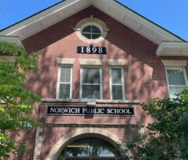 New signs on the outside of MCS, "Norwich Public School" and "1898"