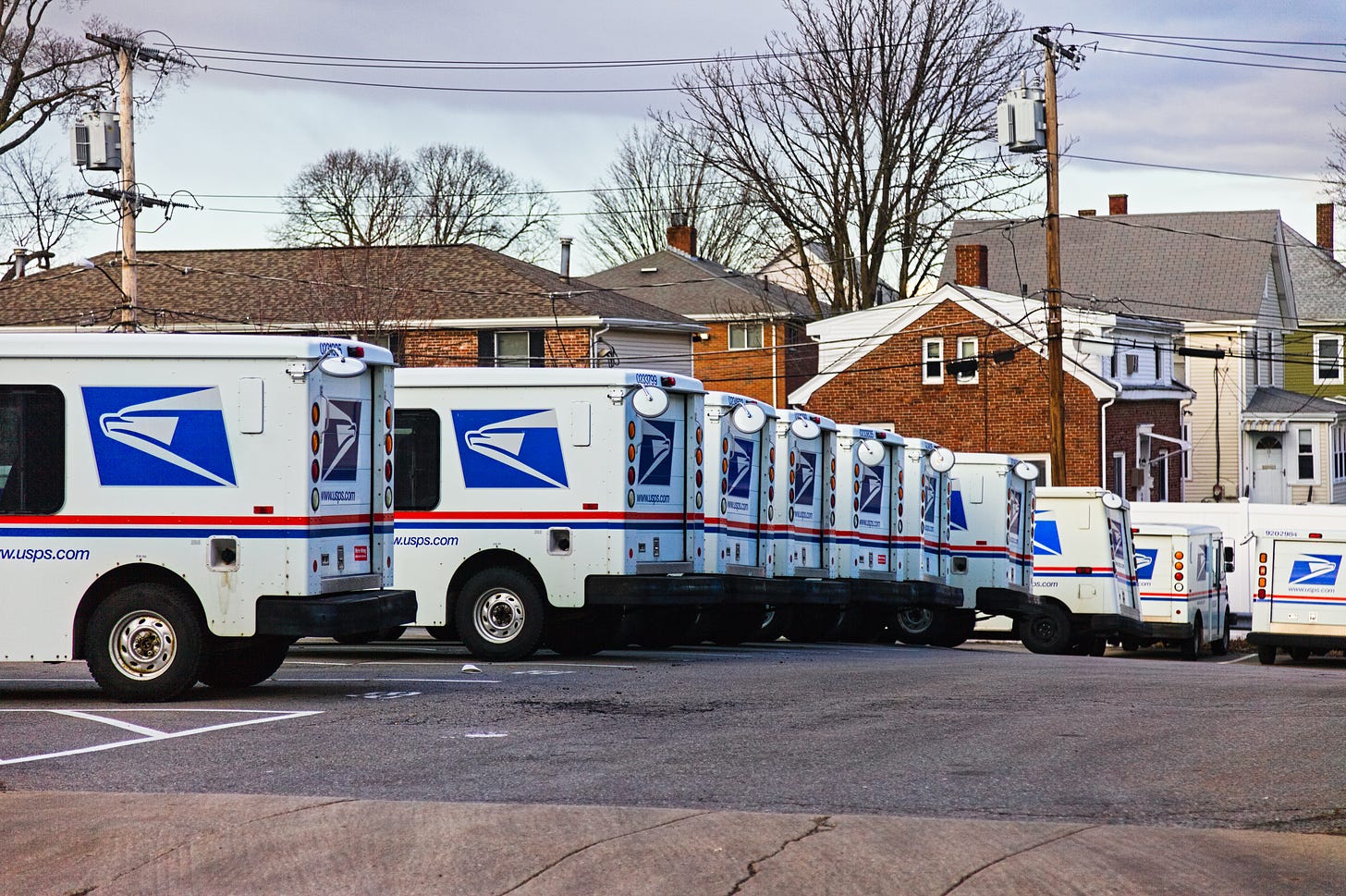 Row of parked postal trucks