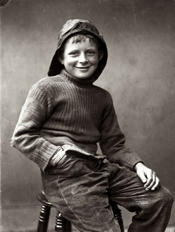 “Fisher Boy”, photographed in about 1890, revealed that the woollen knitted sweater had been heavily worn on the chest (some visible darning) and elbows. Several of Frank Meadow Sutcliffe’s photographs are evidence of ganseys often worn as everyday clothes, even when they show considerable wear-and-tear or have large holes. Warmth and comfort always came first, but even a tiny hole in a knitted garment can soon become big if not quickly darned. (Courtesy: Whitby Museum, Photographic Collection, Sutcliffe, 24-33E). 