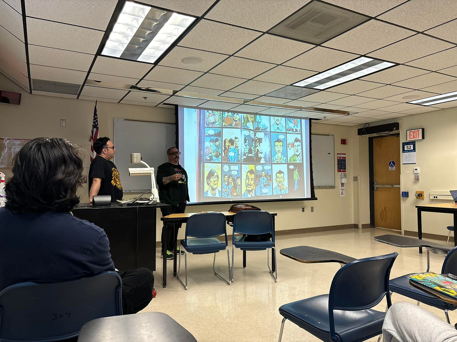 Henry and J Gonzo discussing the making and significance of their graphic novel La Voz De MAYO Tata Rambo during a classroom talk at the University of Arizona in the Cesar Chavez building.  Photo by Maurice Rafael Magaña, Ph.D.