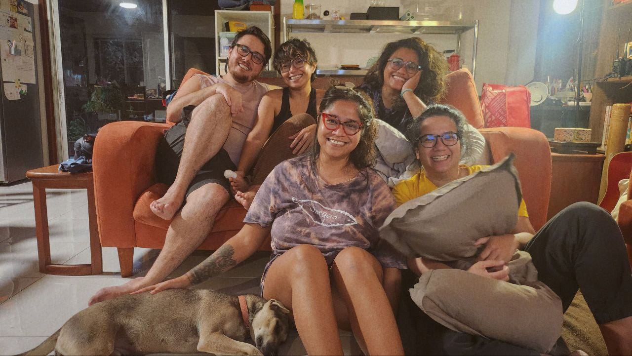 Alia and her forged family, smiling.