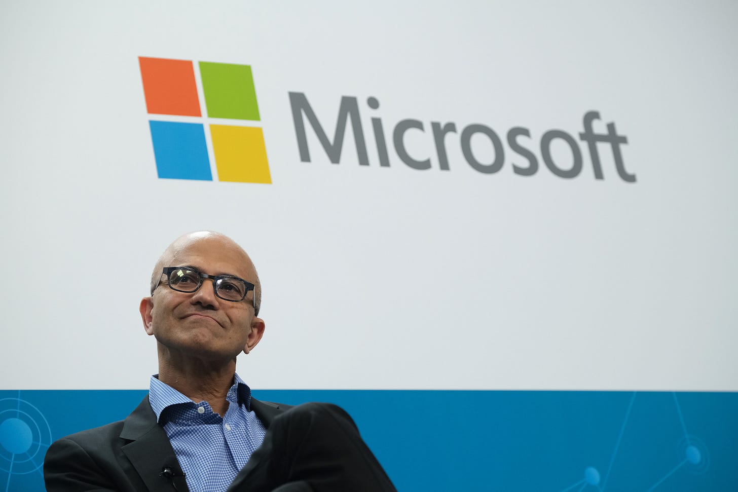 BERLIN, GERMANY - FEBRUARY 27: Satya Nadella, CEO of Microsoft, speaks with Herbert Diess, CEO of Volkswagen AG, (not pictured) at a "fireside chat" to the media about a joint project between the two companies called the Volkswagen Automotive Cloud on February 27, 2019 in Berlin, Germany. Microsoft is working with several automakers to advance the carmakers' digitalization. (Photo by Sean Gallup/Getty Images)