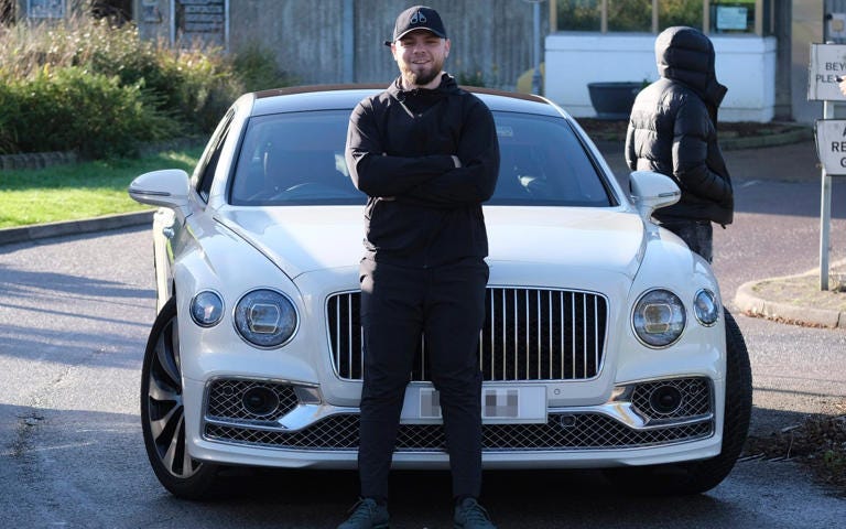 Daniel Dowling-Brooks thanks the Prime Minister while posing next to a Bentley after his release on Tuesday - Steve Finn