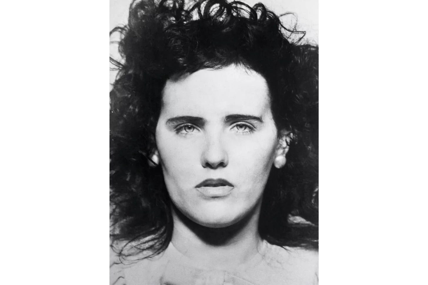 The FBI disclosed tonight that the fingerprints of a young woman whose mutilated body was found yesterday in a Los Angeles parking lot were those of Miss Elizabeth Short