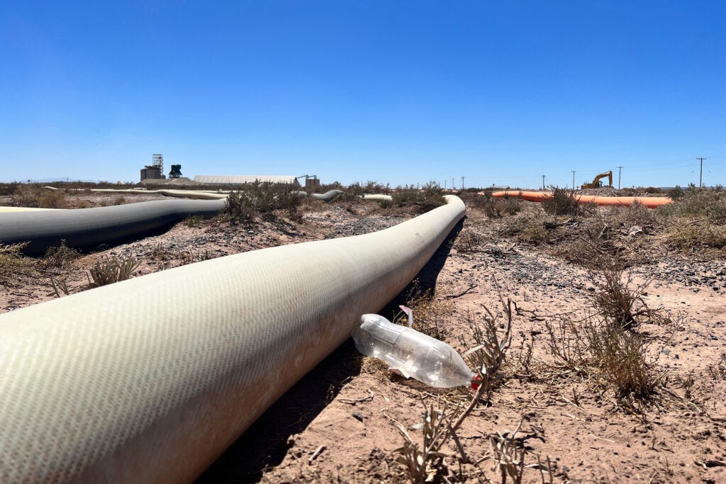 Known as "anacondas," pipes carry water from the Neuquen river to fracking sites where it is mixed with a slurry of sand, chemicals and other additives then forced deep underground to break rock and release trapped oil and gas. Credit: Katie Surma/Inside Climate News