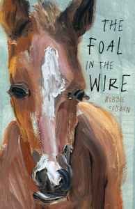 A brown foal with a white stripe down its head against a green background. It is next to black text that says The Foal in the Wire by Robbie Coburn.