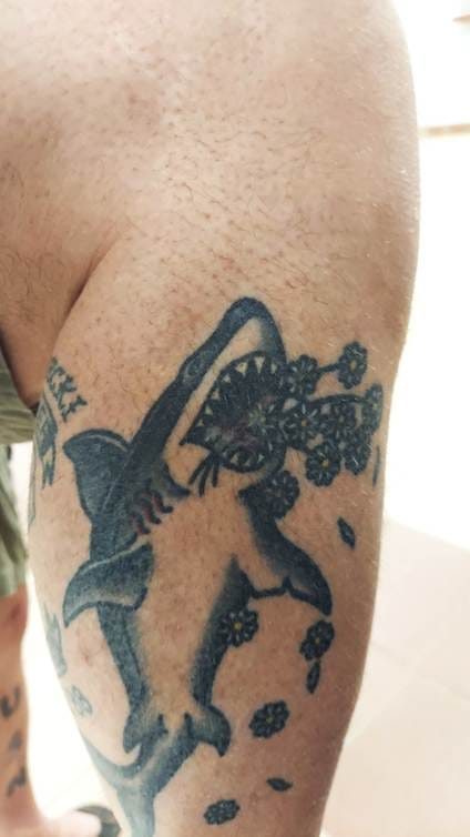 A tattoo on a person's arm

AI-generated content may be incorrect.