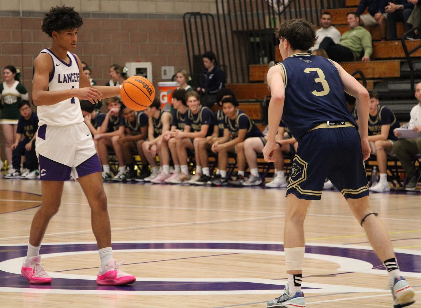 The Carlsbad High School boys basketball team is led by senior guard Tony Duckett, left, and Jake Hall (not pictured). The two lead the Lancers into the CIF San Diego Section tournament. Anya Keast photo