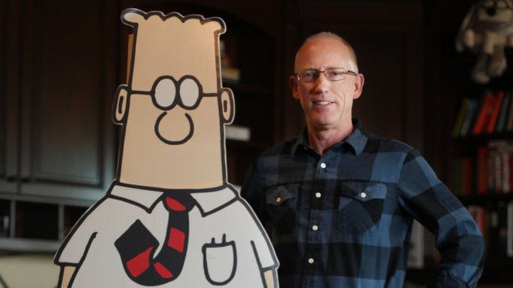 Elon Musk accuses media of racism after Dilbert creator Scott Adams dropped  - BBC News