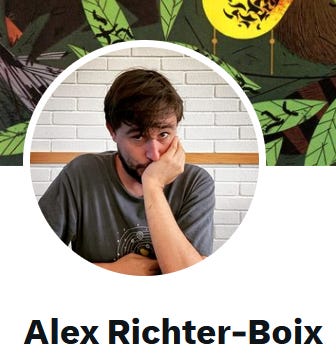Picture of Alex Ricther-Boix looking at the camera covering his mouth with his hand.