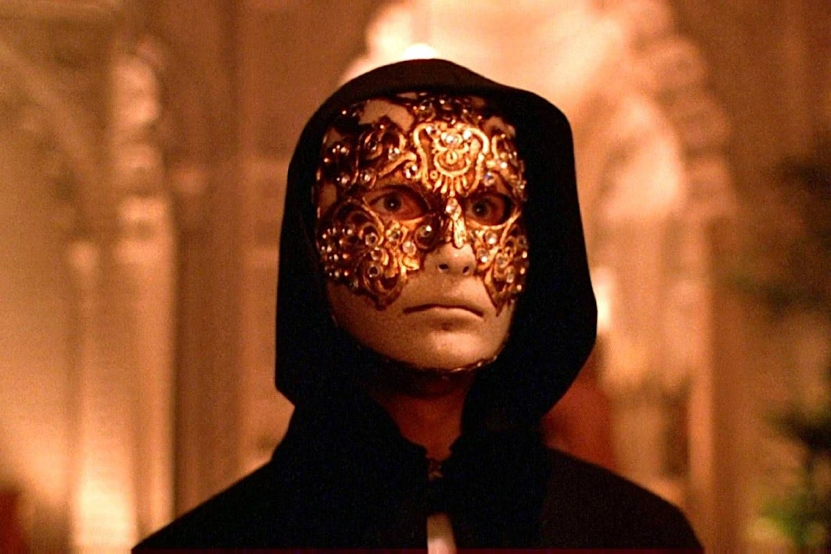 Tom Cruise wearing a Venetian ball mask in the film Eyes Wide Shut.