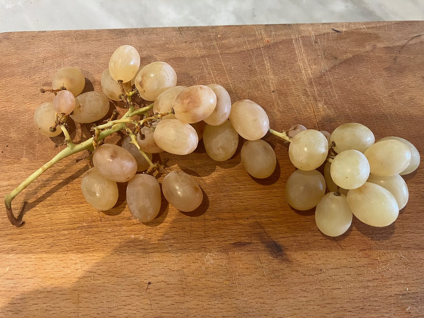 Italia muscat grapes on a wooden board