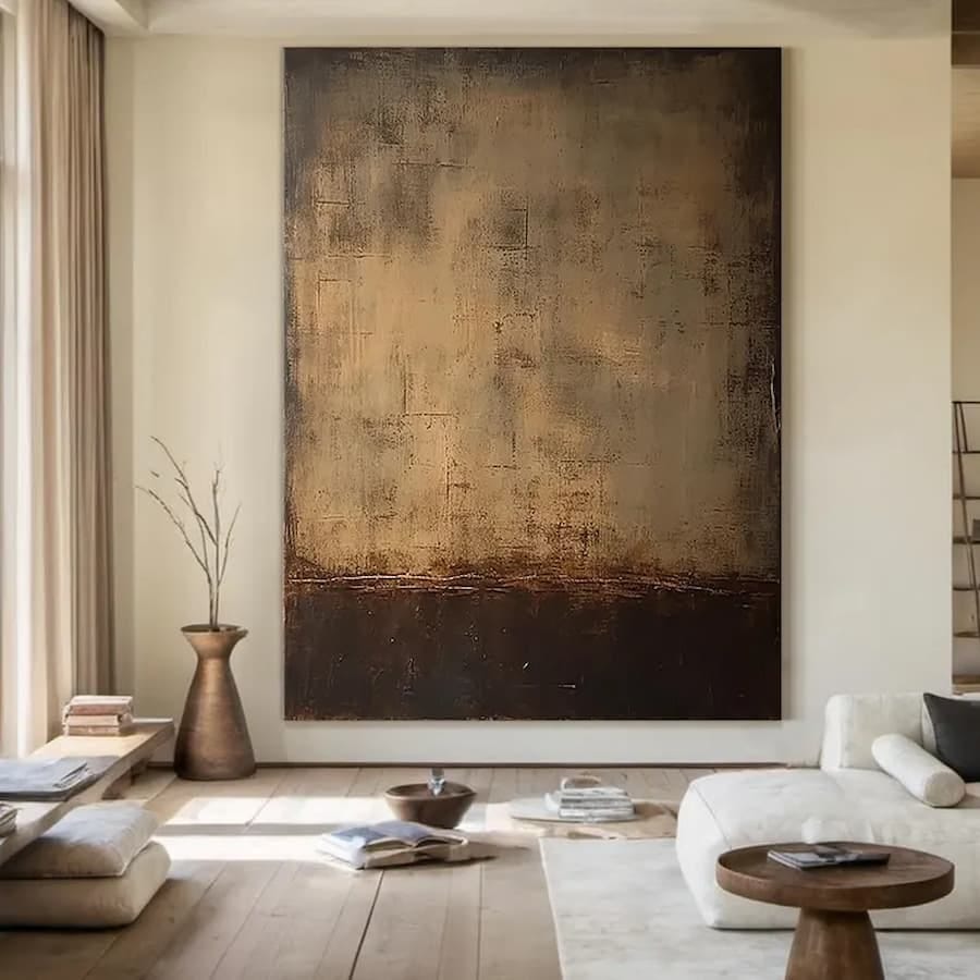 large artwork in tones of brown on a living room wall