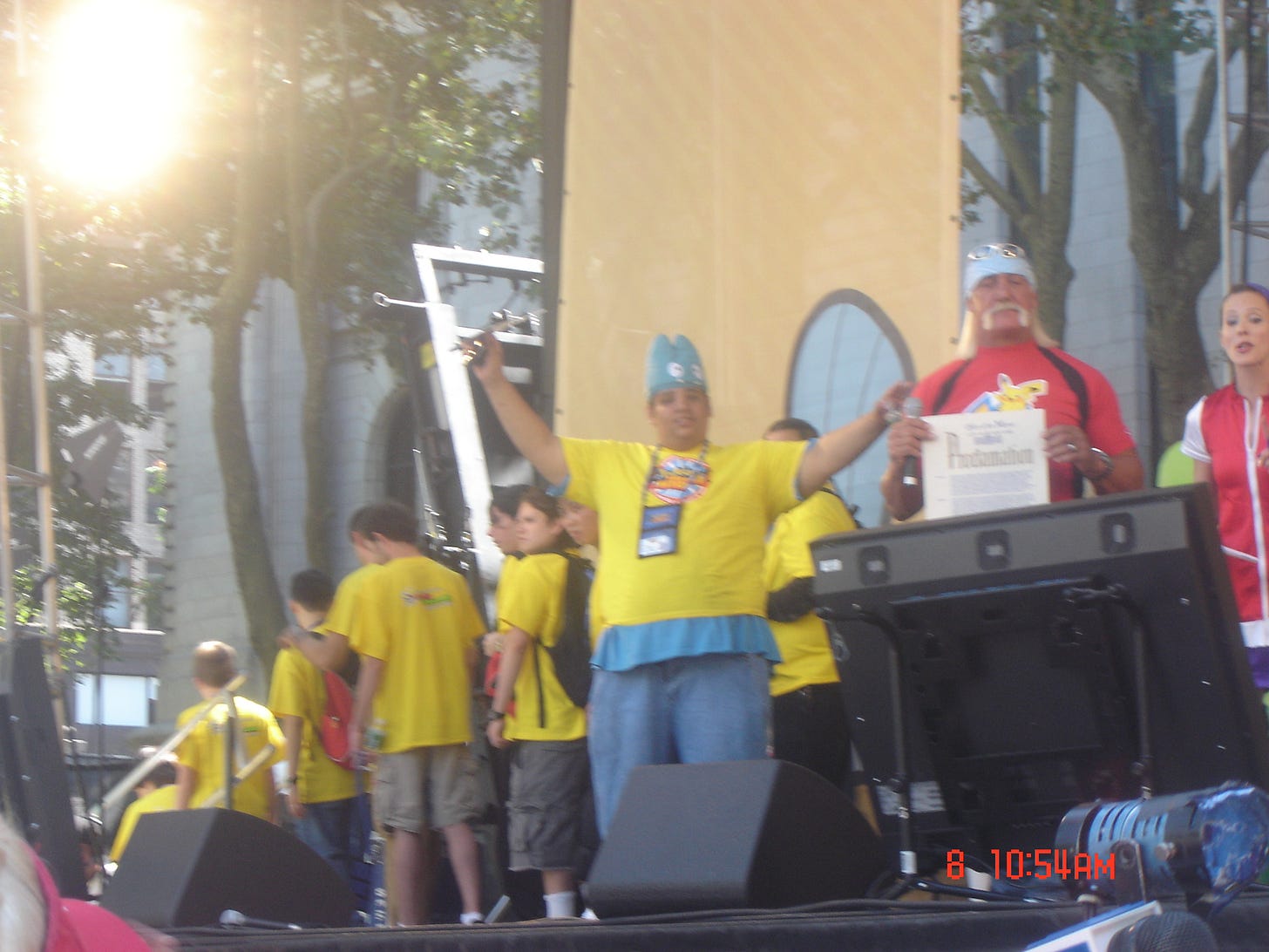 Peter on stage with professional wrestler Hulk Hogan, the host of the show