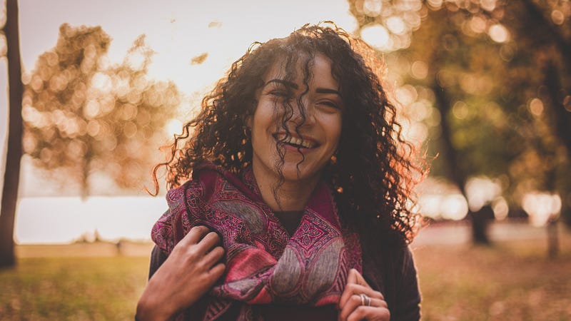 Smiling girl with curly hair