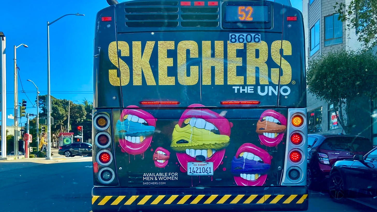 A bus with a Skechers ad