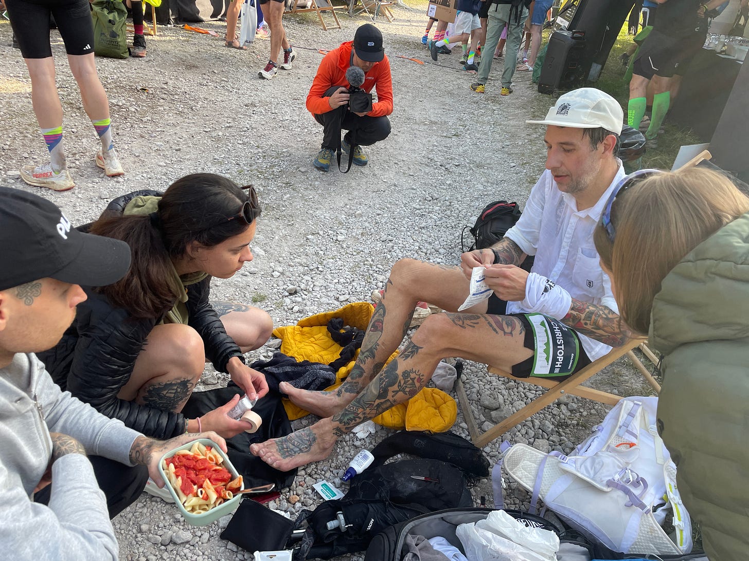The author getting his blistered feet patched up