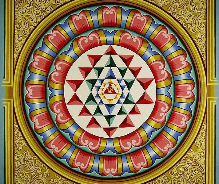 File:A Yantra with Tamil Om symbol in center, at a Mariamman Temple.jpg