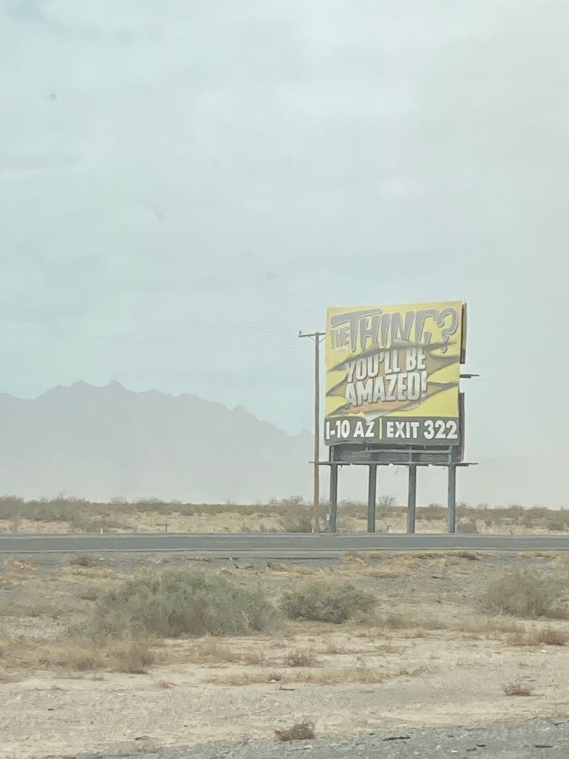 A dusty billboard in an Arizona landscape. It reads: THE THING? YOU'LL BE AMAZED. I Googled it and...I don't think I would be.