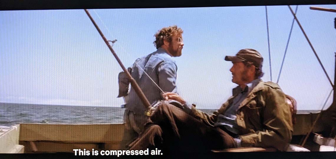 A still from Jaws: Cooper is saying 'This is compressed air'.