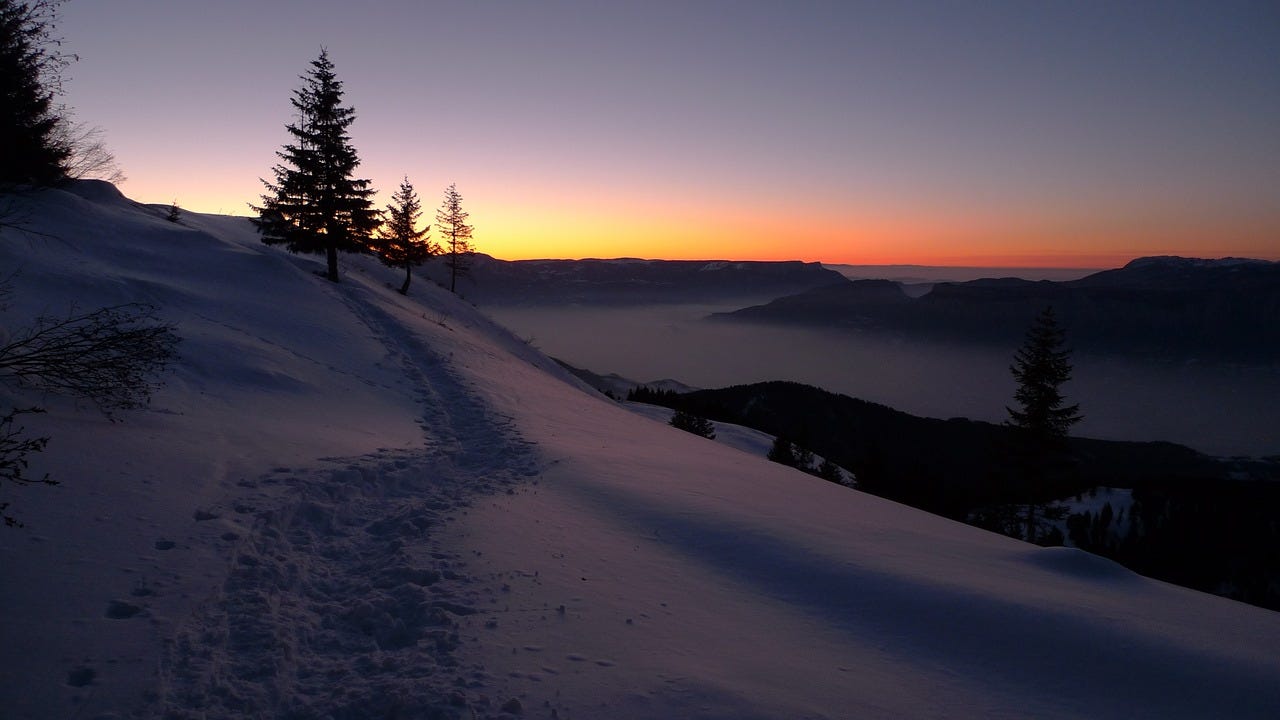 sunrise over a snowy field