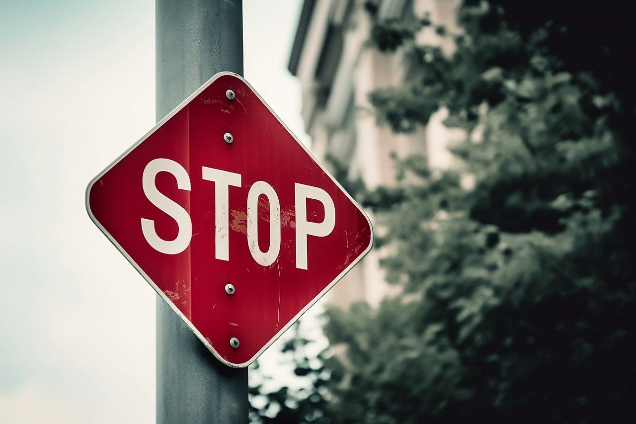 An AI generated image of a stop sign that uses the wrong shape (a diamond) and has an uneven “O” in the middle of the word “STOP”