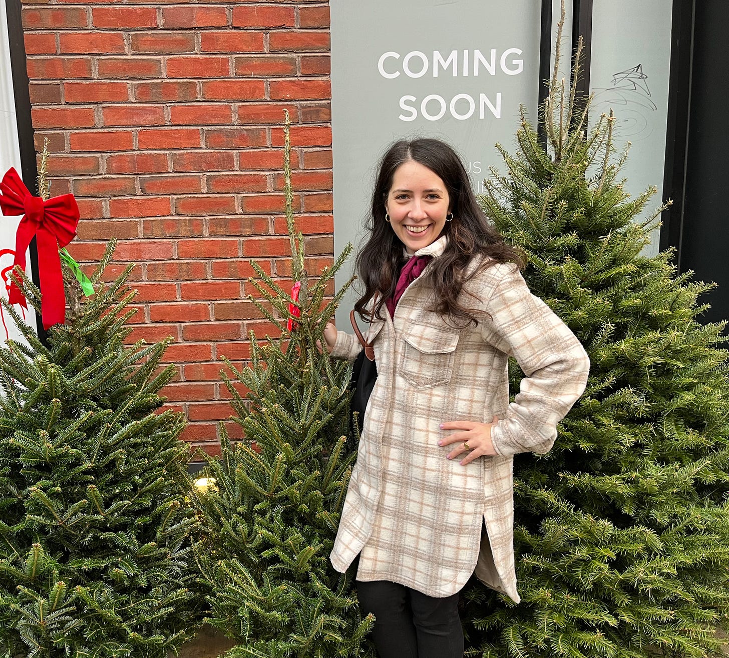 christina heiser next to christmas tree