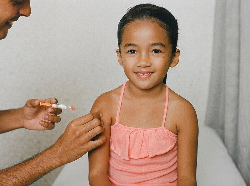 File:Closeup of girl in doctor's office receiving a vaccine from a healthcare professional (48586536306).jpg