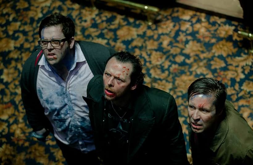 Screencap from The World's End with Simon Pegg, Nick Frost, and Paddy Considine exhausted, staring up at the representative of an alien hive mind bent on enslaving Earth to bring about world peace.