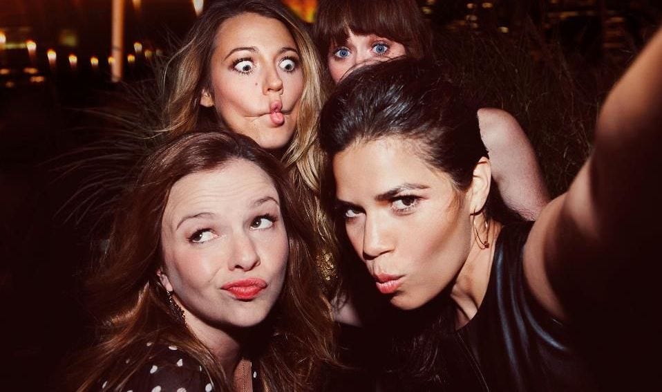 A selfie taken at an event. America Ferrera, Amber Tamblyn, Blake Lively, and Alexis Bledel all make funny faces into the camera.