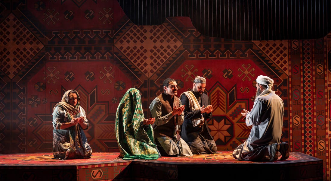 Rasheed and Laila are being married in a traditional ceremony. Her face is covered by a veil. Mariam sits behind, with a distressed expression on her face. All of the characters have their hands raised in prayer
