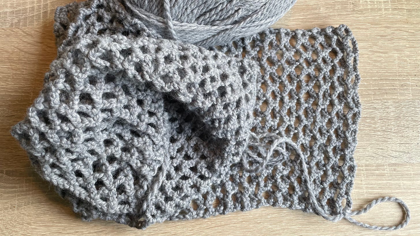 Photo of a crocheted diamond lattice scarf