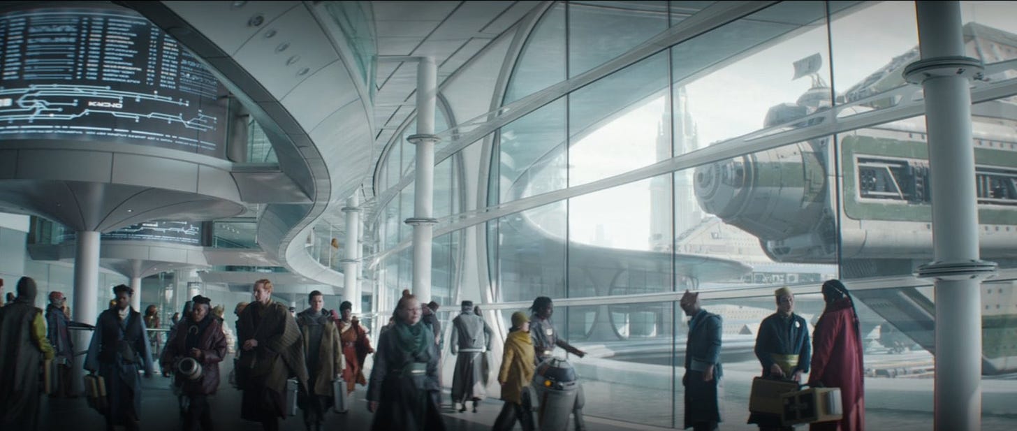 Interior of a busy high-tech spaceport with spaceships visible out the large windows
