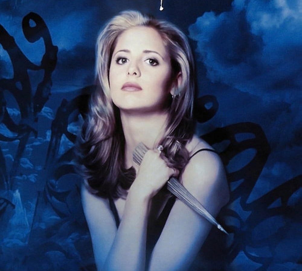 Buffy the vampire slayer holding a stake