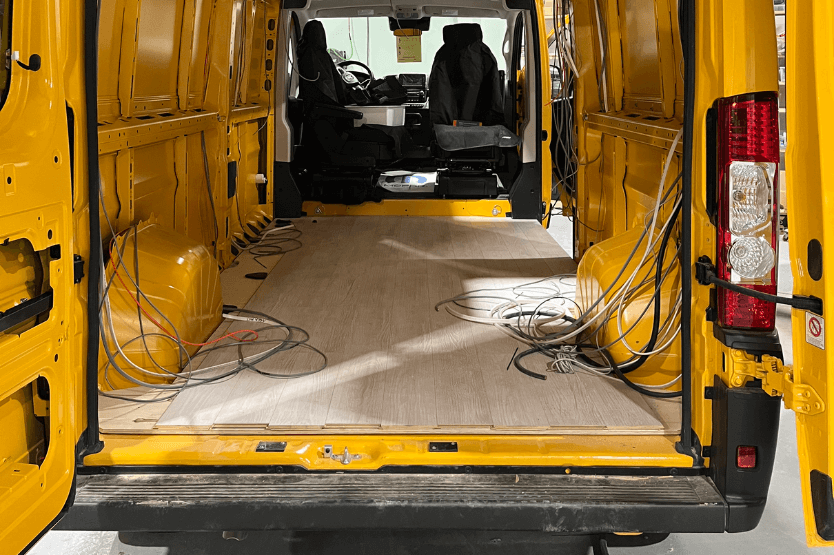 A photo of Hermes, a yellow Promaster van that will be our future home on wheels, sent to us by our conversion company Rossmonster