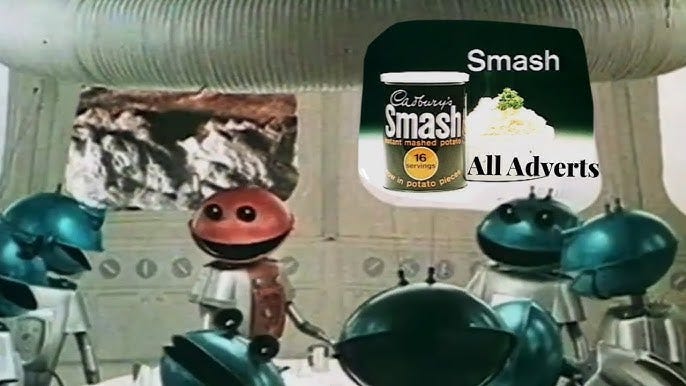 A still from the advert for Cadbury's Smash featuring alien robots mocking humans