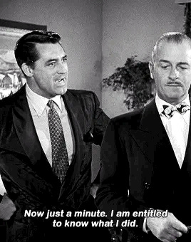 Carey Grant meme says 'Wait a minute I deserve to know what I did