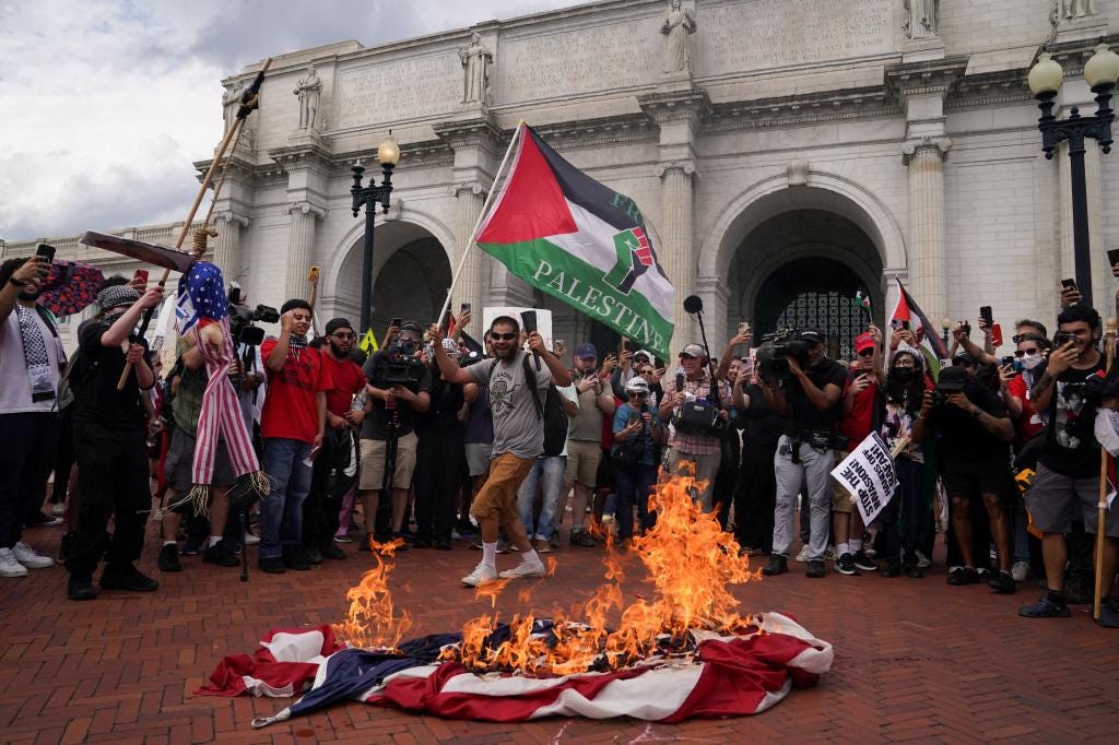 Anti-Israel rioters burn US flag, attempt to breach Capitol Police line in  DC