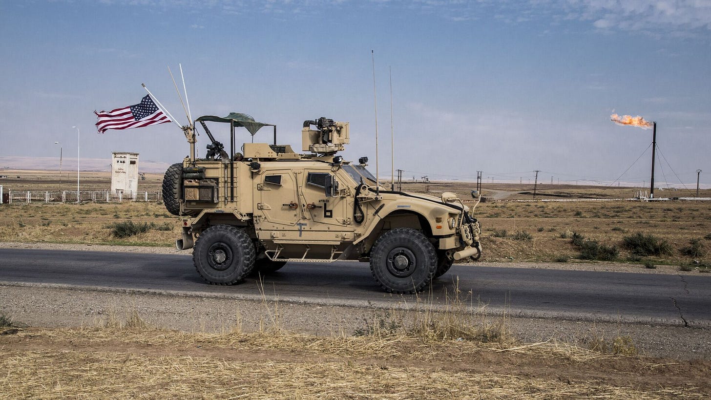 In this Monday, Oct. 28, 2019 file photo, U.S. forces patrol Syrian oil fields, in eastern Syria.President Donald Trump's decision to dispatch new U.S. forces to eastern Syria to secure oil fields is being criticized by some experts as ill-defined and ambiguous. - Sputnik International, 1920, 11.12.2024