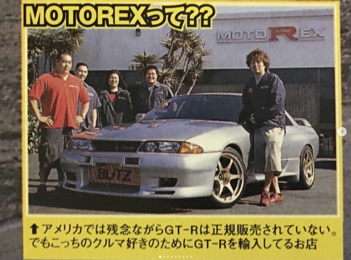 Hiro Nanahoshi, founder of MotoRex, standing alongside his personal grey R32 Skyline GT-R in an old magazine article photo.