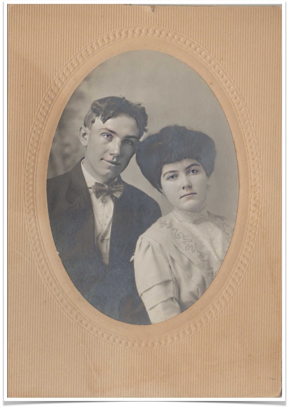 Sepia-toned image of a young couple. Circa 1910-1912.