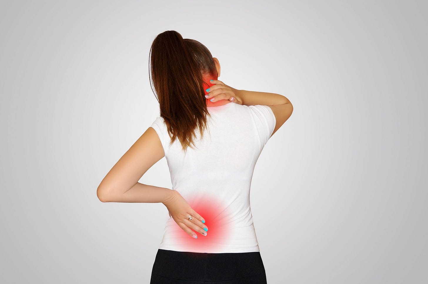 Young woman suffering from back and shoulder pain 