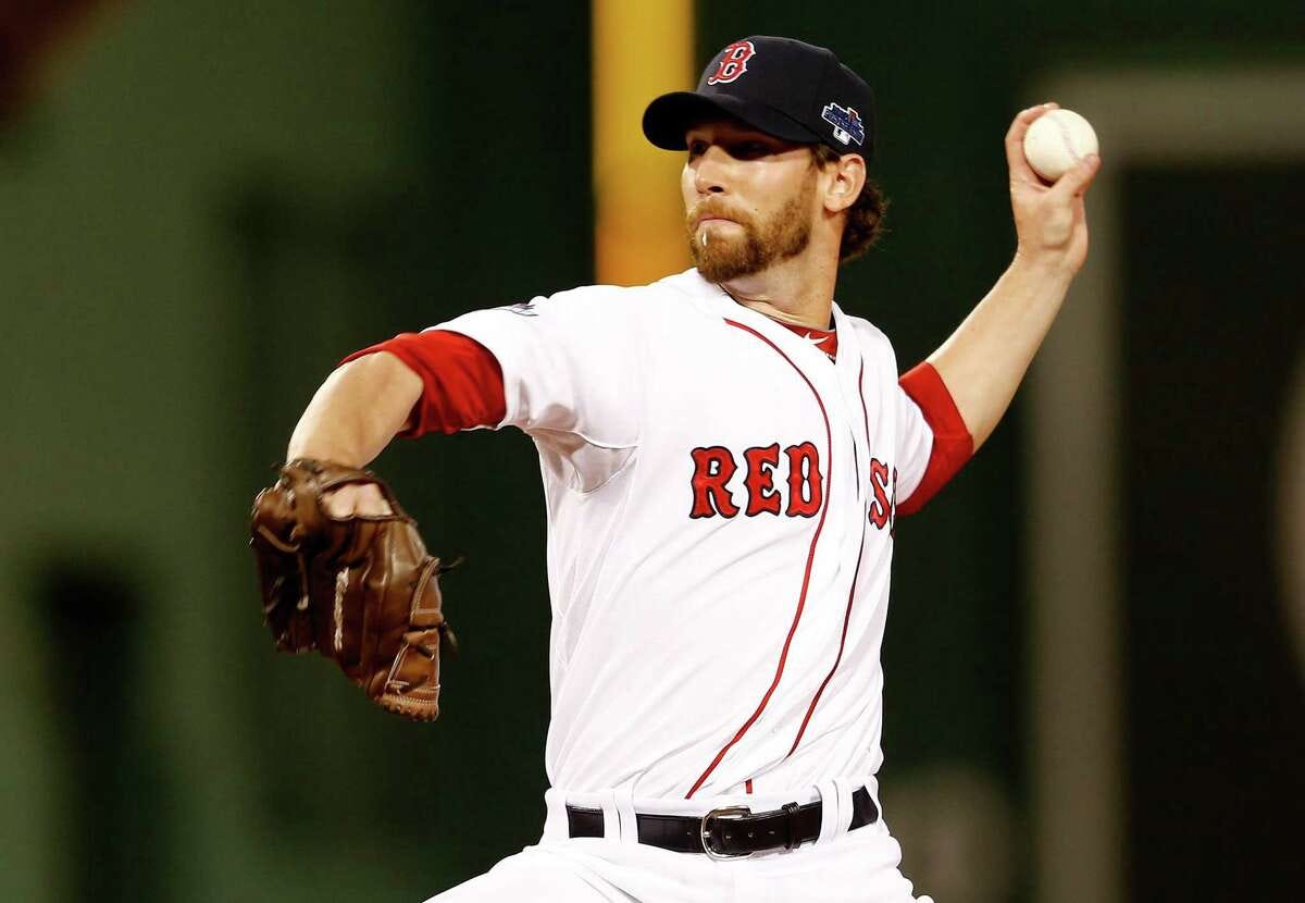 BOSTON, MA - OCTOBER 05: Craig Breslow #32 of the Boston Red Sox pitches against the Tampa Bay Rays during Game Two of the American League Division Series at Fenway Park on October 5, 2013 in Boston, Massachusetts. (Photo by Jim Rogash/Getty Images)