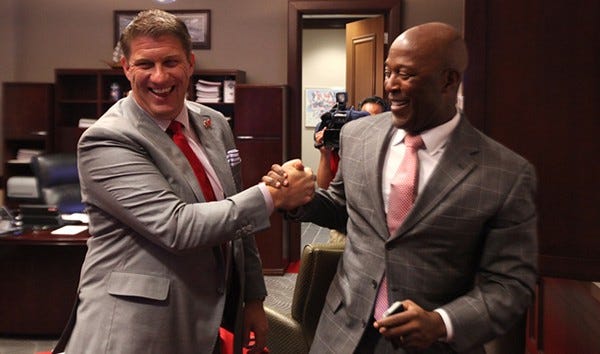 jason licht grips hands with coach lovie smith for tampa bay buccaneers 2015