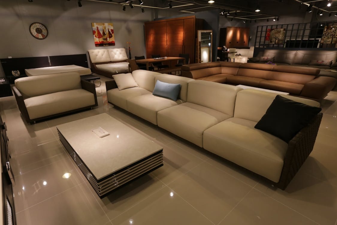 Free Elegant living room showcasing modern furniture with plush sofas and ambient lighting. Stock Photo Free Elegant living room showcasing modern furniture with plush sofas and ambient lighting. Stock Photo