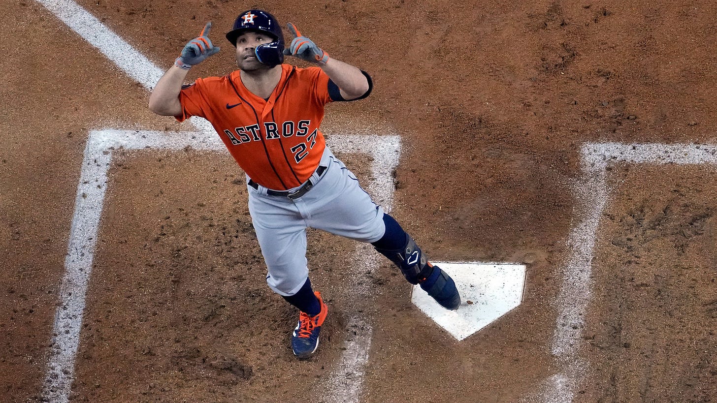 Jose Altuve points to the sky after stepping on home plate following his home run