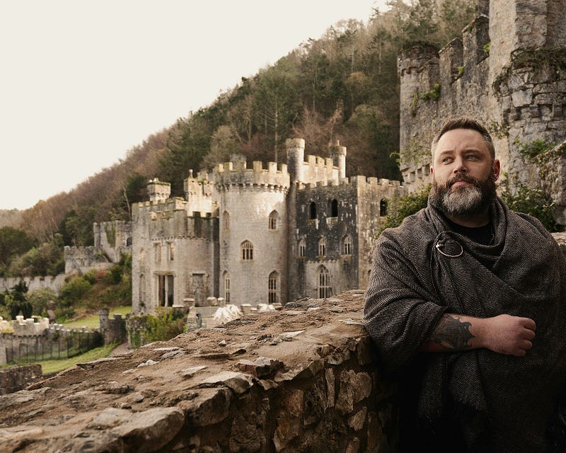 Man in front of castle Man in front of castle