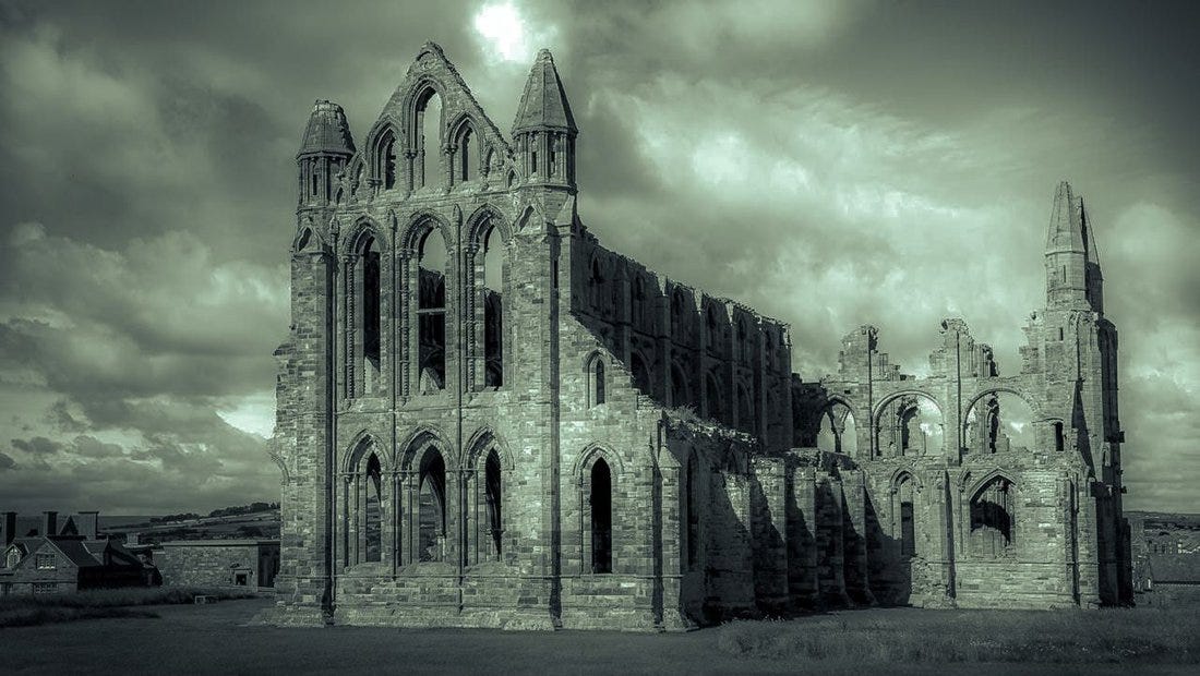 Black and white photo of Whitby Abbey on a cloudy day