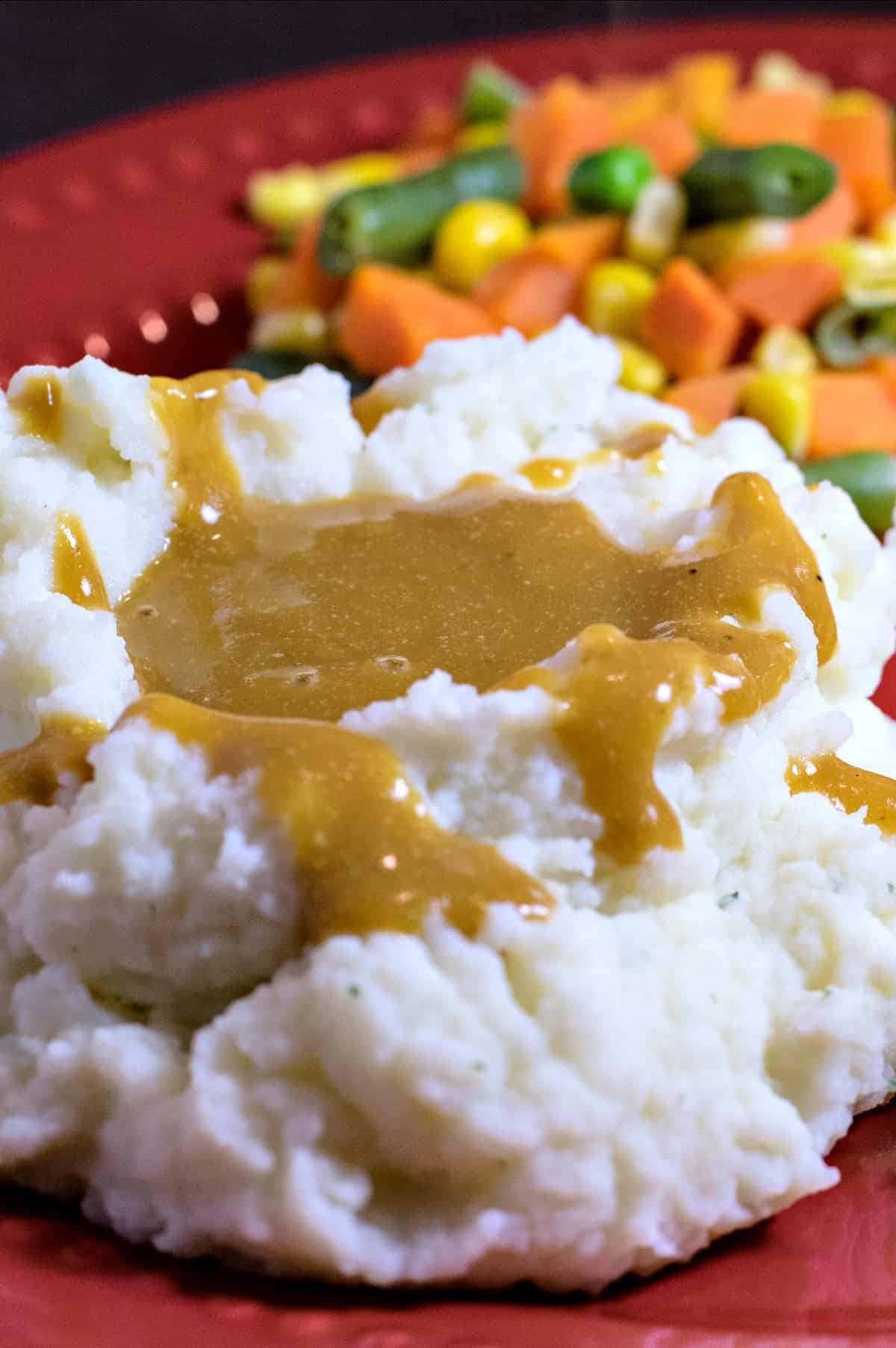 closeup of mashed potatoes and gravy