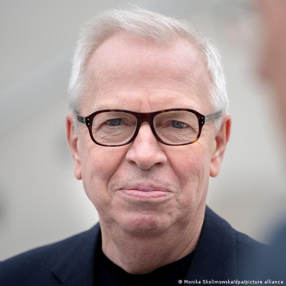 A close-up photograph of British architect and urban planner David Chipperfield 